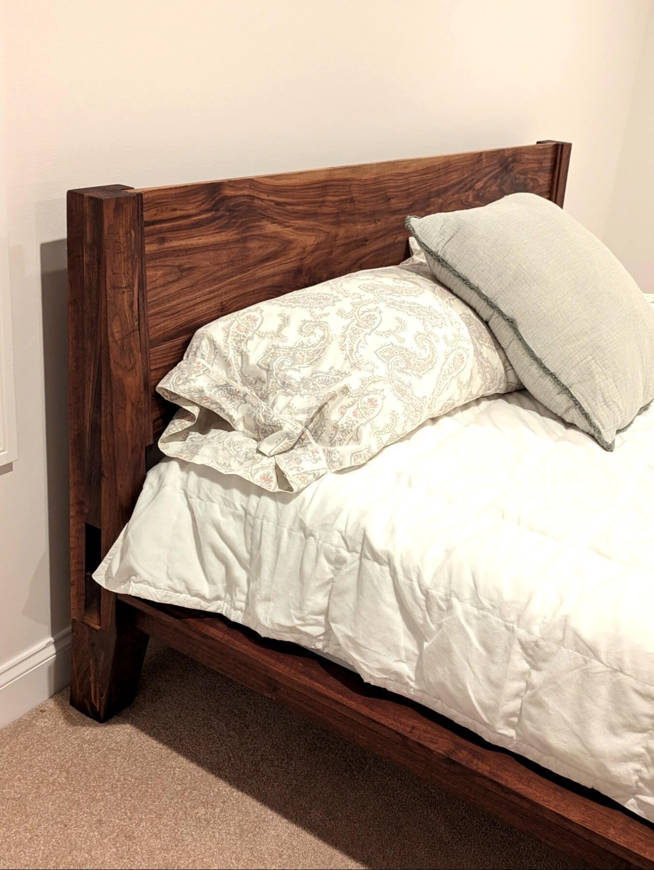 Black walnut headboard of The Bastion king bed