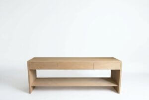 Modern media console in white oak with three drawers